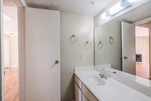 bathroom featuring vanity and wood finished floors