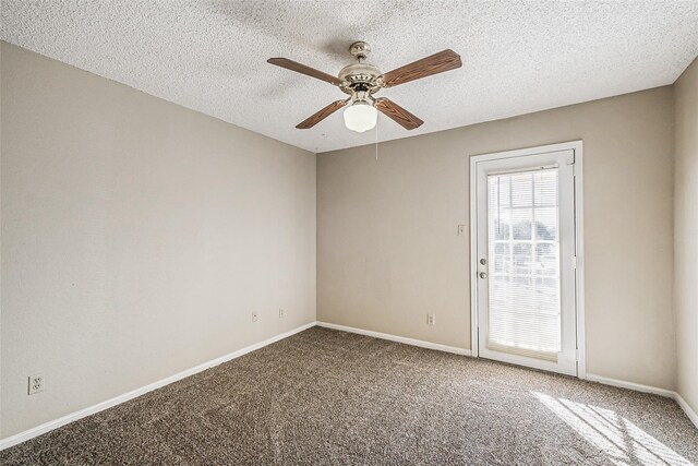 unfurnished room with carpet flooring, a textured ceiling, baseboards, and a ceiling fan
