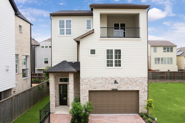 10935 Brookeshire Chase Ln, Houston, TX 77043 - view of front of property with stone siding, an attached garage, decorative driveway, and a balcony