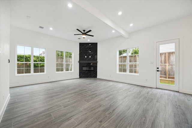 10935 Brookeshire Chase Ln, Houston, TX 77043 - unfurnished living room with ceiling fan, baseboards, healthy amount of natural light, wood finished floors, and recessed lighting