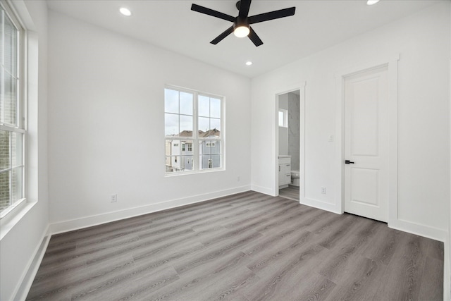 10935 Brookeshire Chase Ln, Houston, TX 77043 - unfurnished bedroom featuring recessed lighting, wood finished floors, ensuite bathroom, baseboards, and a ceiling fan