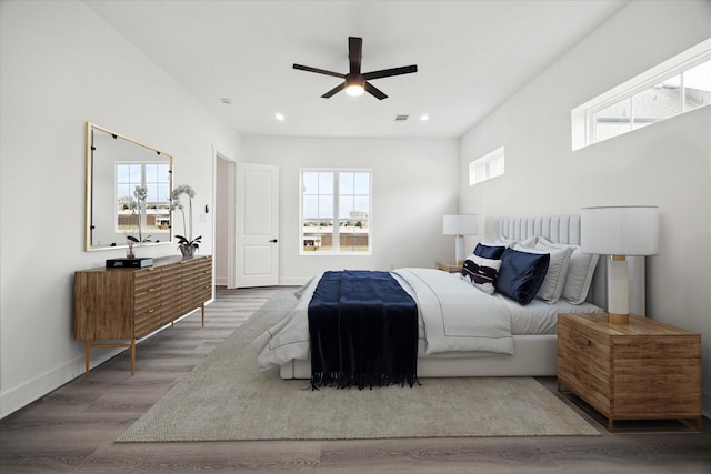 10935 Brookeshire Chase Ln, Houston, TX 77043 - bedroom featuring multiple windows, wood finished floors, recessed lighting, baseboards, and a ceiling fan