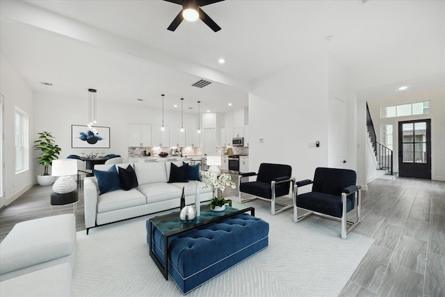 10935 Brookeshire Chase Ln, Houston, TX 77043 - living room featuring stairs, ceiling fan, recessed lighting, and baseboards