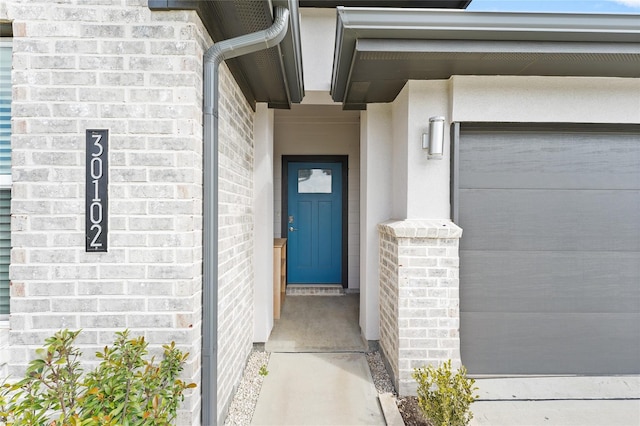 30102 Reagans Ranch Dr, Katy, TX 77494 - entrance to property with stucco siding, brick siding, and a garage
