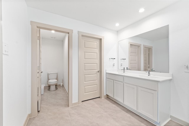 30102 Reagans Ranch Dr, Katy, TX 77494 - bathroom featuring a sink, double vanity, toilet, and tile patterned floors