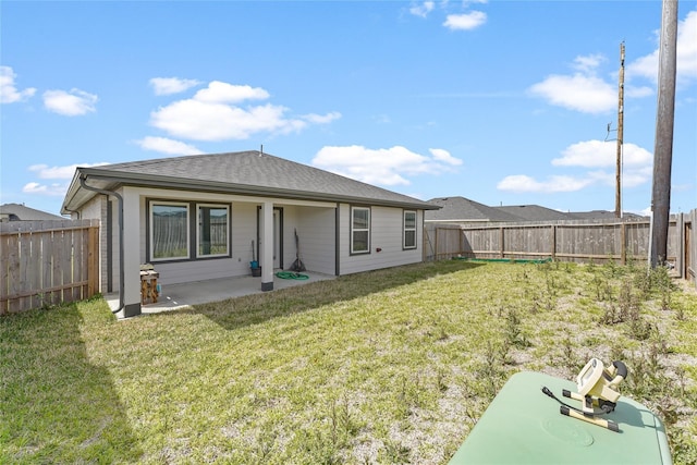 30102 Reagans Ranch Dr, Katy, TX 77494 - rear view of house with a lawn, a patio area, and a fenced backyard