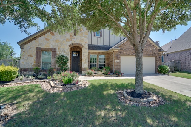 4803 Birch Grove Dr, Fulshear, TX 77441 - view of front of property with board and batten siding, driveway, a garage, stone siding, and brick siding