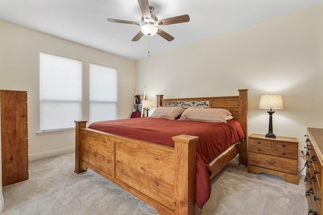 4803 Birch Grove Dr, Fulshear, TX 77441 - bedroom with light colored carpet, ceiling fan, and baseboards