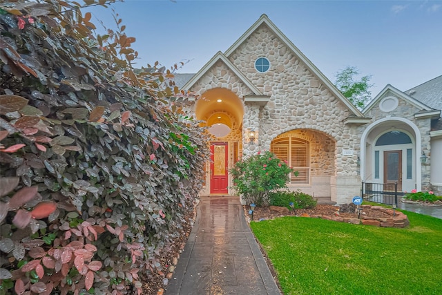 122 Marble Staff Ct, Houston, TX 77069 - view of front facade with stone siding and a front lawn