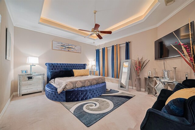 122 Marble Staff Ct, Houston, TX 77069 - carpeted bedroom with crown molding, a tray ceiling, baseboards, and a ceiling fan