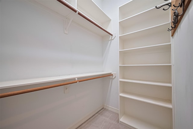 122 Marble Staff Ct, Houston, TX 77069 - walk in closet featuring light colored carpet