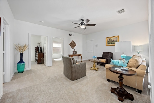 15306 Clearhaven Ct, Cypress, TX 77429 - living area featuring baseboards, visible vents, ceiling fan, and light colored carpet