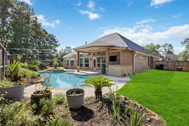 15306 Clearhaven Ct, Cypress, TX 77429 - view of pool featuring a lawn, a ceiling fan, a pool with connected hot tub, a patio area, and a fenced backyard