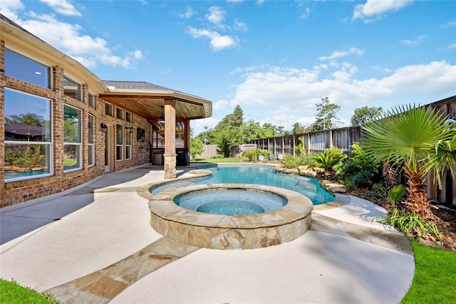 15306 Clearhaven Ct, Cypress, TX 77429 - outdoor pool featuring an in ground hot tub, a patio, and a fenced backyard