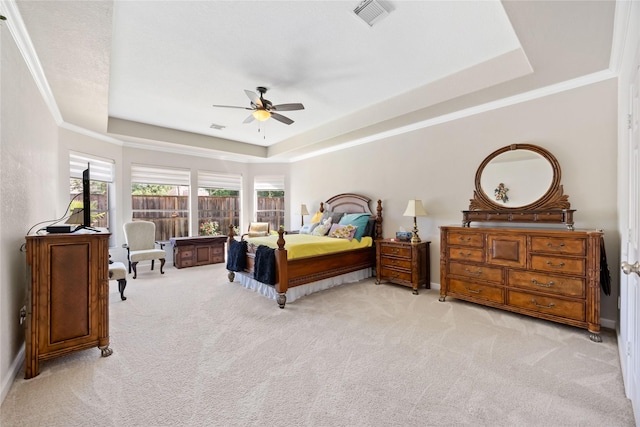 15306 Clearhaven Ct, Cypress, TX 77429 - carpeted bedroom featuring ceiling fan, ornamental molding, a tray ceiling, and visible vents