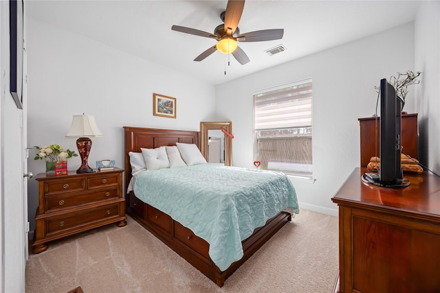 15306 Clearhaven Ct, Cypress, TX 77429 - bedroom featuring light colored carpet, visible vents, baseboards, and a ceiling fan