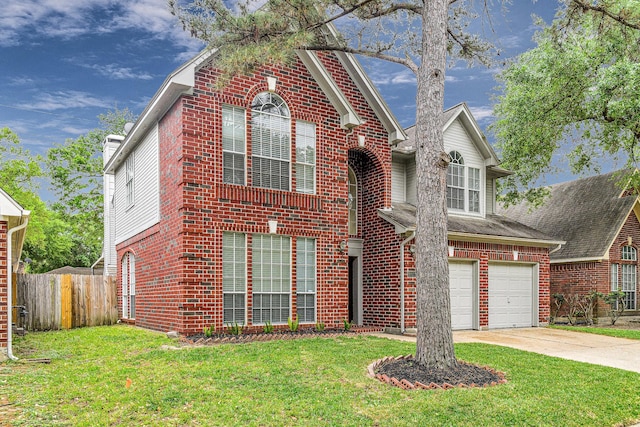 traditional home with fence, an attached garage, brick siding, and concrete driveway