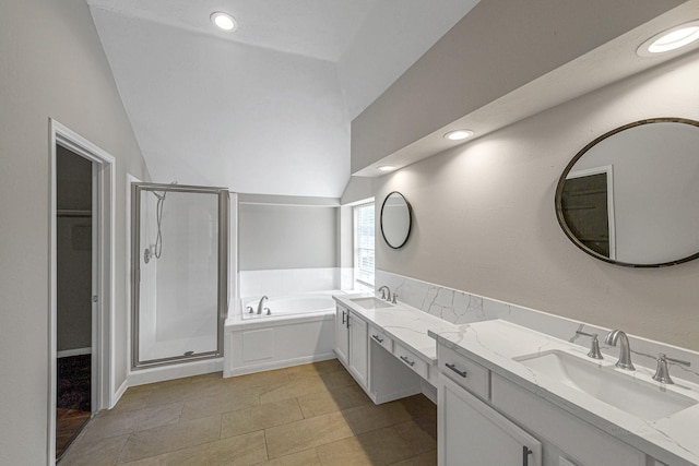 bathroom with a shower stall, a bath, double vanity, and a sink