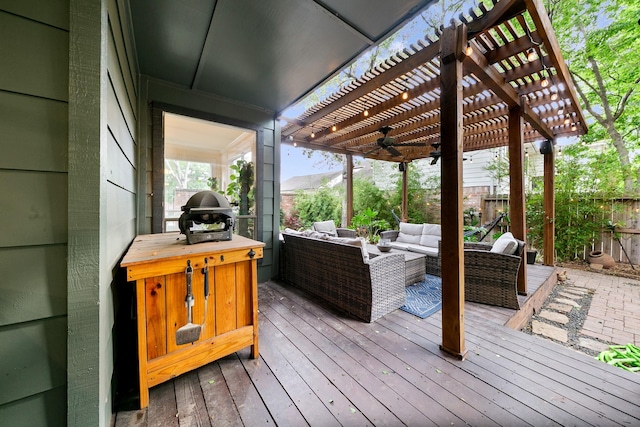 wooden deck featuring an outdoor living space, a pergola, fence, and a ceiling fan
