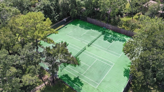 view of tennis court with fence
