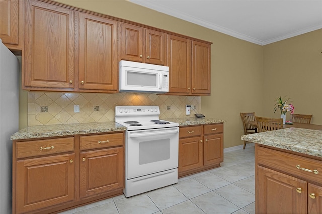kitchen with brown cabinets, white appliances, and decorative backsplash