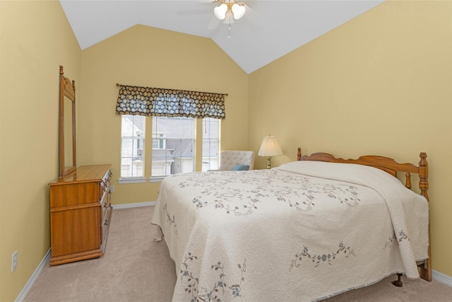 bedroom with light carpet, baseboards, lofted ceiling, and ceiling fan