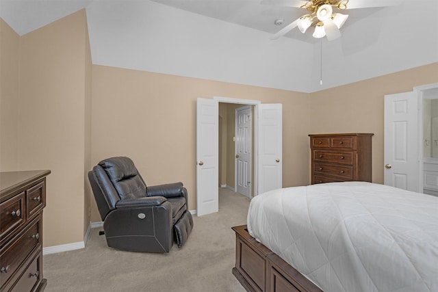 bedroom featuring light colored carpet, a ceiling fan, baseboards, and lofted ceiling