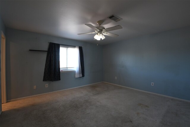 7521 Beaudelaire Cir, Galveston, TX 77551 - carpeted empty room featuring a ceiling fan and baseboards