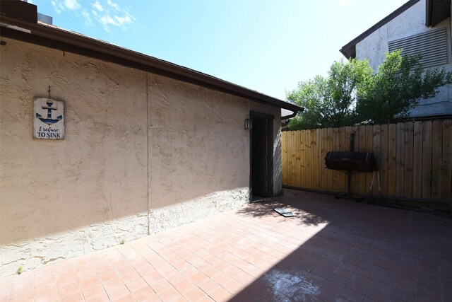 7521 Beaudelaire Cir, Galveston, TX 77551 - view of patio / terrace featuring fence