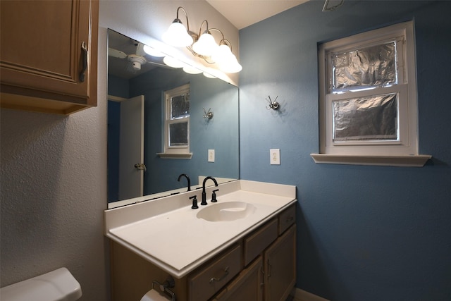 7521 Beaudelaire Cir, Galveston, TX 77551 - bathroom featuring toilet and vanity