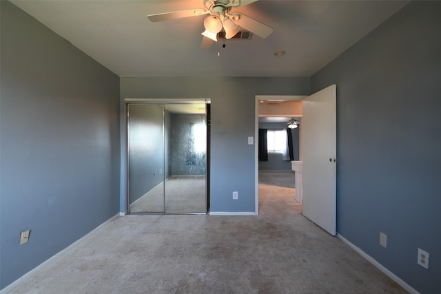 7521 Beaudelaire Cir, Galveston, TX 77551 - unfurnished bedroom featuring a closet, carpet flooring, baseboards, and a ceiling fan