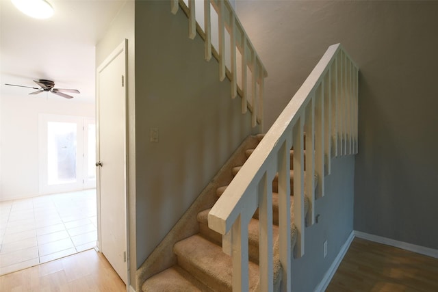 7521 Beaudelaire Cir, Galveston, TX 77551 - stairway featuring a ceiling fan and wood finished floors