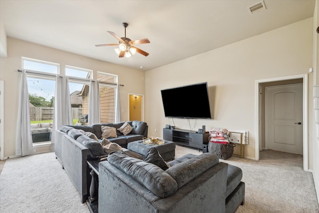 13921 Pebble Falls Ln, Pearland, TX 77584 - living area with light colored carpet, ceiling fan, and baseboards