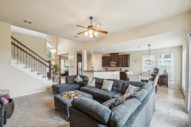 13921 Pebble Falls Ln, Pearland, TX 77584 - living area with light colored carpet, ceiling fan, stairs, baseboards, and recessed lighting
