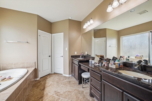 13921 Pebble Falls Ln, Pearland, TX 77584 - full bath with double vanity, a bath, and tile patterned floors