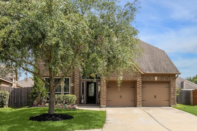 13921 Pebble Falls Ln, Pearland, TX 77584 - view of front of property with brick siding, driveway, a garage, and roof with shingles