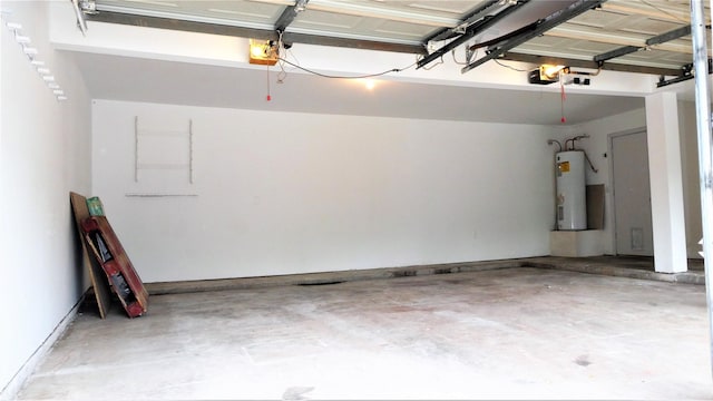 garage featuring water heater and a garage door opener