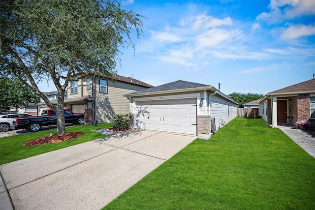 view of front facade with a front yard, driveway, brick siding, and fence