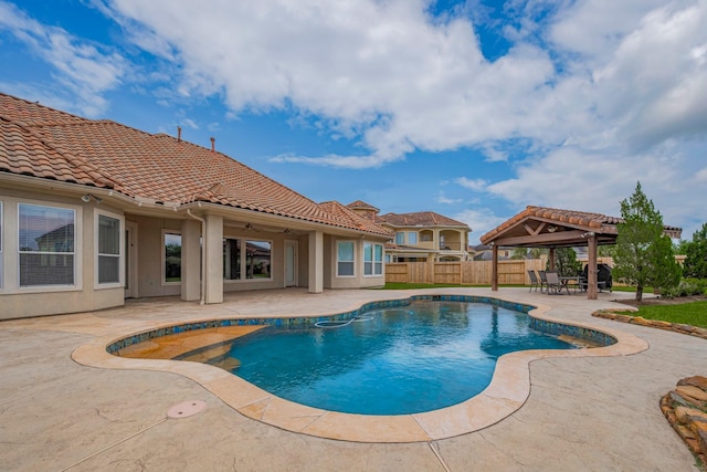 12404 Baymeadow Dr, Pearland, TX 77584 - view of swimming pool featuring a patio, a ceiling fan, fence, a gazebo, and a fenced in pool