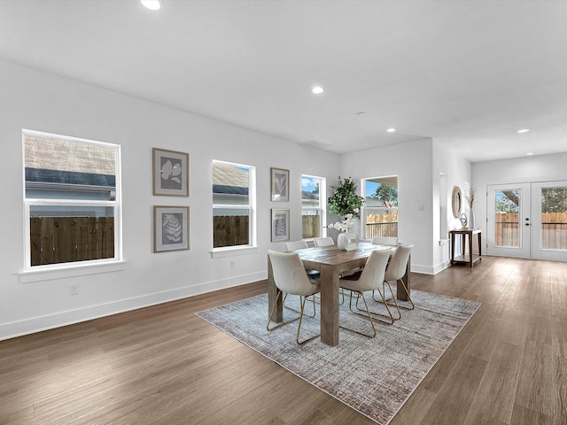 dining space with baseboards, french doors, recessed lighting, and wood finished floors
