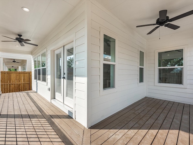 wooden terrace featuring a ceiling fan