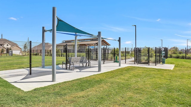 view of home's community featuring a lawn, a gazebo, and fence