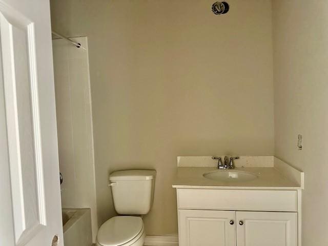 full bath featuring vanity, toilet, baseboards, and  shower combination