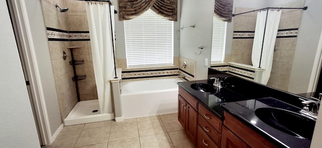 full bathroom with a shower stall, tile patterned flooring, a bath, and double vanity