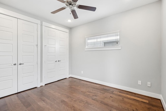 334 Yale Oaks Ln, Houston, TX 77091 - unfurnished bedroom with baseboards, dark wood-style floors, recessed lighting, a ceiling fan, and a closet