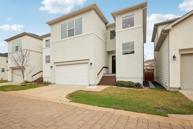 334 Yale Oaks Ln, Houston, TX 77091 - view of front facade with stucco siding, concrete driveway, a garage, and a front yard
