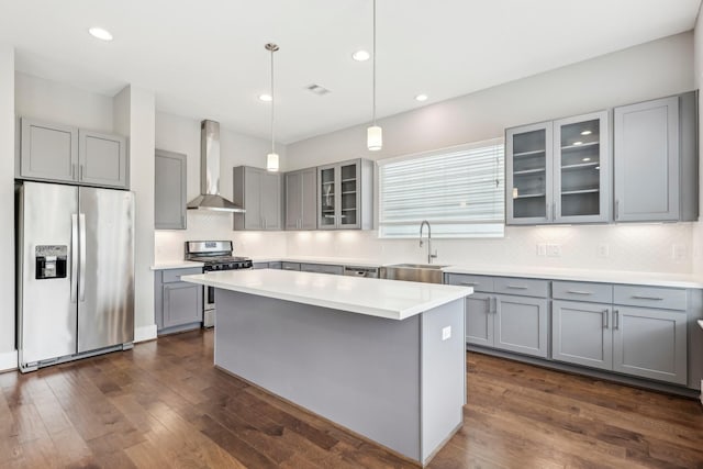 334 Yale Oaks Ln, Houston, TX 77091 - kitchen with stainless steel appliances, wall chimney exhaust hood, gray cabinetry, a sink, and recessed lighting