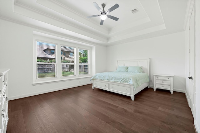 18914 Trinity Star Dr, Cypress, TX 77433 - bedroom featuring a raised ceiling, dark wood-style flooring, ornamental molding, baseboards, and ceiling fan