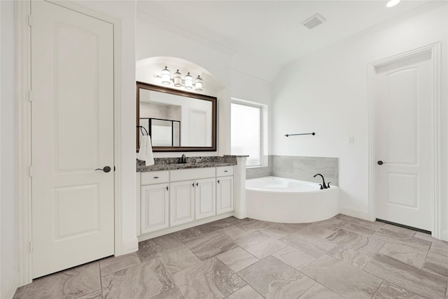 18914 Trinity Star Dr, Cypress, TX 77433 - bathroom featuring a garden tub, vanity, and marble finish flooring