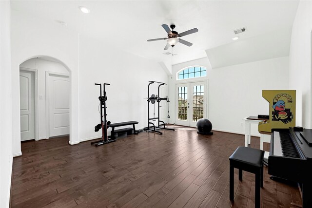 18914 Trinity Star Dr, Cypress, TX 77433 - exercise area with ceiling fan, dark wood-style flooring, arched walkways, vaulted ceiling, and baseboards